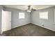 Bright bedroom offers updated ceiling fan, two windows, and neutral paint to customize at 2087 John Wesley Ct, Decatur, GA 30035