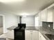 Kitchen featuring granite countertops, modern appliances, tile backsplash, providing an efficient workspace at 2087 John Wesley Ct, Decatur, GA 30035