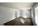 Cozy living room features carpet, light fixture, and sun-lit windows, providing a welcoming space at 2087 John Wesley Ct, Decatur, GA 30035