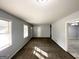 Bright, open living room features carpet, natural light from the windows and access to other rooms at 2087 John Wesley Ct, Decatur, GA 30035