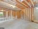 Unfinished basement shows framing, utilities, and room for customization at 10018 Clearwater Trl, Jonesboro, GA 30238