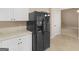 This modern kitchen includes a black refrigerator and crisp white cabinets at 10018 Clearwater Trl, Jonesboro, GA 30238