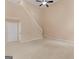 Open living room with natural light, plush carpeting, and convenient access to doors at 10018 Clearwater Trl, Jonesboro, GA 30238