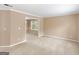 A spacious living room featuring neutral walls and plush carpeting at 10018 Clearwater Trl, Jonesboro, GA 30238