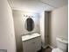 Bathroom features granite vanity, mirror and vanity lighting at 837 Needle Rock Dr, Stone Mountain, GA 30083