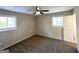 Bedroom featuring neutral paint, plush carpeting, and a ceiling fan at 837 Needle Rock Dr, Stone Mountain, GA 30083