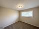 Bedroom with light walls and neutral carpeting at 837 Needle Rock Dr, Stone Mountain, GA 30083
