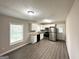 Bright kitchen featuring white cabinets and stainless steel appliances at 837 Needle Rock Dr, Stone Mountain, GA 30083