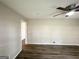 Bright living room featuring modern ceiling fan, wood flooring and neutral paint at 837 Needle Rock Dr, Stone Mountain, GA 30083
