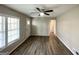 Bright living room with wood flooring, large windows, and natural light at 837 Needle Rock Dr, Stone Mountain, GA 30083
