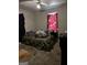 Bedroom featuring carpet floors, a bed, and a window with a curtain at 104 14Th St, Cumming, GA 30040