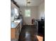 Kitchen with wood floors, stove, and sink and showing needed repairs at 104 14Th St, Cumming, GA 30040