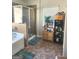 Relaxing bathroom featuring soaking tub, glass shower, and decorative shelving with great natural light at 3620 Pickeral St, Fairburn, GA 30213