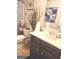 Bathroom featuring a vanity with decor, toilet, and framed art at 3620 Pickeral St, Fairburn, GA 30213