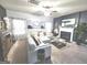Cozy living room featuring a fireplace, plush seating, and stylish decor at 3620 Pickeral St, Fairburn, GA 30213