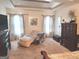 Bright main bedroom with sitting area, large windows, and ample space for relaxation and comfort at 3620 Pickeral St, Fairburn, GA 30213