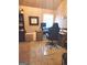 The office offers a computer, rolling chair, desk, and area rug at 3620 Pickeral St, Fairburn, GA 30213