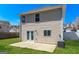Rear exterior featuring a patio area, a well-maintained lawn, and vinyl siding at 312 Silver Fox Trl, Dallas, GA 30157