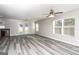 Spacious living room boasting modern gray floors, double doors, and ample natural light at 312 Silver Fox Trl, Dallas, GA 30157