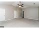 A spacious main bedroom featuring neutral walls, plush carpeting, and bright natural light from large windows at 312 Silver Fox Trl, Dallas, GA 30157