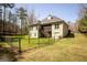 Spacious backyard with fenced in lawn and two-story home at 50 Clear Spring Ct, Oxford, GA 30054