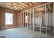 Unfinished basement framing shows layout with window and doorway in place at 50 Clear Spring Ct, Oxford, GA 30054