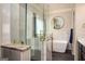 Bathroom showcasing marble tile, glass shower and soaking tub at 50 Clear Spring Ct, Oxford, GA 30054