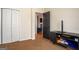 View of bedroom showing closet, black TV stand, doorway and neutral wall color at 50 Clear Spring Ct, Oxford, GA 30054