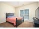 Bedroom with neutral walls, carpet and large window allowing ample natural light at 50 Clear Spring Ct, Oxford, GA 30054