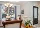 Charming dining area showcases wainscoting, a chandelier, and a large window providing ample natural light at 50 Clear Spring Ct, Oxford, GA 30054