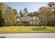 Charming brick home with mature landscaping and a lush green lawn, creating curb appeal at 50 Clear Spring Ct, Oxford, GA 30054