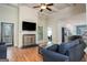 Bright living room featuring a cozy fireplace, hardwood floors, and an open floor plan perfect for entertaining at 50 Clear Spring Ct, Oxford, GA 30054