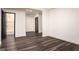 Bright, spacious room with dark hardwood floors and access to a bathroom at 50 Clear Spring Ct, Oxford, GA 30054