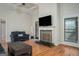 Cozy living room showcasing a fireplace, ample seating, and natural light, creating a comfortable space at 50 Clear Spring Ct, Oxford, GA 30054