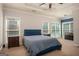 Spacious main bedroom with tray ceilings, carpet and large windows at 50 Clear Spring Ct, Oxford, GA 30054