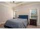 Main bedroom featuring tray ceilings, carpet flooring and natural light at 50 Clear Spring Ct, Oxford, GA 30054