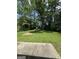 A lovely backyard offers ample space for outdoor activities, with lush greenery and shady trees at 2900 Haddon Dr, Rex, GA 30273