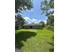 A spacious backyard offers a lush lawn, a patio, and mature trees providing ample shade at 2900 Haddon Dr, Rex, GA 30273