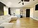Inviting living room features new floors, large windows and a comfy sectional at 2900 Haddon Dr, Rex, GA 30273