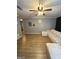 Open living room featuring hardwood floors, a comfortable sectional sofa, and neutral wall colors at 2900 Haddon Dr, Rex, GA 30273