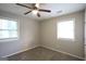 Inviting bedroom with neutral walls, carpet, and windows providing plenty of natural light at 3410 Nw Adkins Rd, Atlanta, GA 30331
