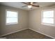 Inviting bedroom with neutral walls, carpet, and windows providing plenty of natural light at 3410 Nw Adkins Rd, Atlanta, GA 30331