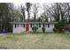 Cozy one-story home featuring a bright red front door and well-kept front yard at 3410 Nw Adkins Rd, Atlanta, GA 30331