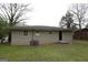 Spacious backyard with an access door and a small patio at 5960 John St, Austell, GA 30106