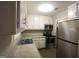 Bright kitchen with stainless steel appliances and updated countertops at 5960 John St, Austell, GA 30106