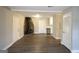 Inviting living room with wood-look floors, fireplace, and fresh paint at 5960 John St, Austell, GA 30106
