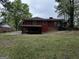 Exterior rear view of home with a covered carport and lawn at 2760 The Fontainebleau Sw, Atlanta, GA 30331