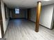 A spacious, unfinished basement offers flexible potential and features updated vinyl flooring at 2760 The Fontainebleau Sw, Atlanta, GA 30331