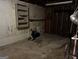 Unfinished basement space with concrete flooring and block walls and utility equipment and storage at 2760 The Fontainebleau Sw, Atlanta, GA 30331