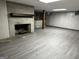 Basement featuring brick fireplace and light grey flooring at 2760 The Fontainebleau Sw, Atlanta, GA 30331